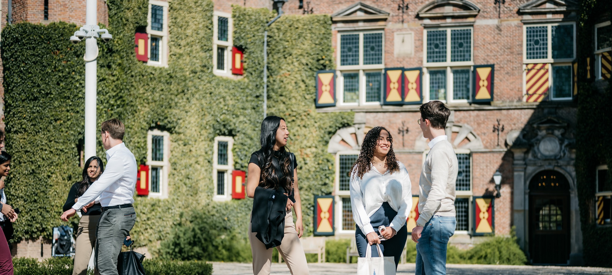 Students hanging out in front of Nyenrode's castle